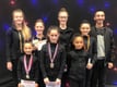 Coaches Ellie and Sergi with gymnasts at Melbourne
